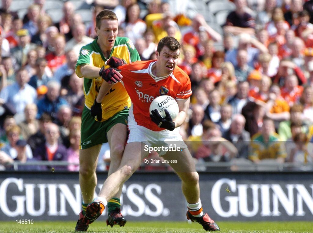 11 July 2004; Ronan Clarke, Armagh, in action against Raymond Sweeney, Donegal. Bank of Ireland Ulster Senior Football Championship Final, Armagh v Donegal, Croke Park, Dublin. Picture credit; Brian Lawless / SPORTSFILE