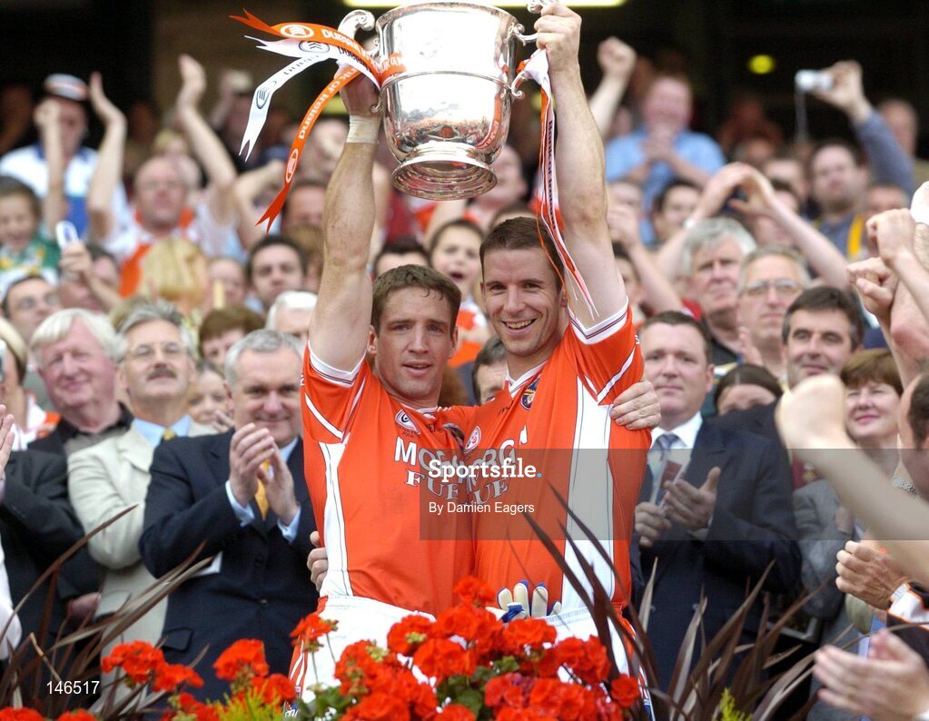 11 July 2004; Armagh captain Kiaran McGeeney and team-mate Paul McGrane, right, lift the Anglo Celt cup. Bank of Ireland Ulster Senior Football Championship Final, Armagh v Donegal, Croke Park, Dublin. Picture credit; Damien Eagers / SPORTSFILE