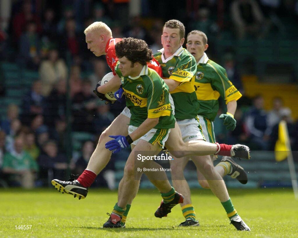 11 July 2004; Sean Dempsey, Cork, in action against Ciaran Kelliher and Luke Quinn, right, Kerry. Munster Minor Football Championship Final, Cork v Kerry, Gaelic Grounds, Limerick. Picture credit; Brendan Moran / SPORTSFILE