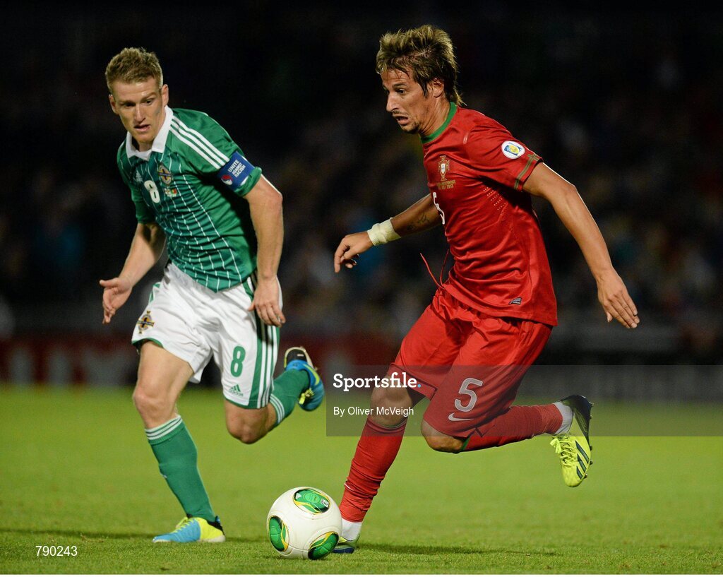 6 September 2013; Fabio Coentrao, Portugal, in action against Steven Davis, Northern Ireland. 2014 FIFA World Cup Qualifier, Group F, Northern Ireland v Portugal, Windsor Park, Belfast.  Picture credit: Oliver McVeigh / SPORTSFILE