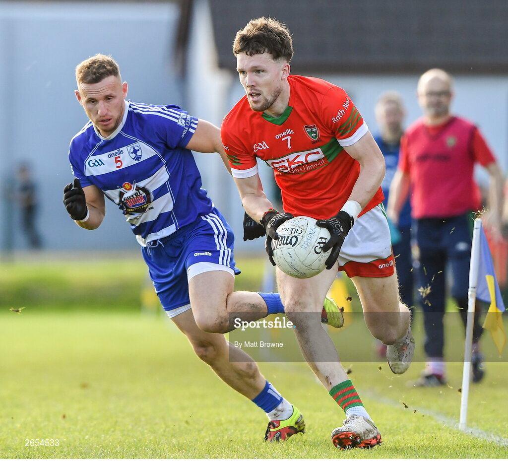 22 October 2023; Sam O'Dowd of Rathnew in action against Kevin Hanlon of Blessington during the Wicklow County Senior Club Football Championship final between Blessington and Rathnew at Echelon Park in Aughrim, Wicklow. Photo by Matt Browne/Sportsfile