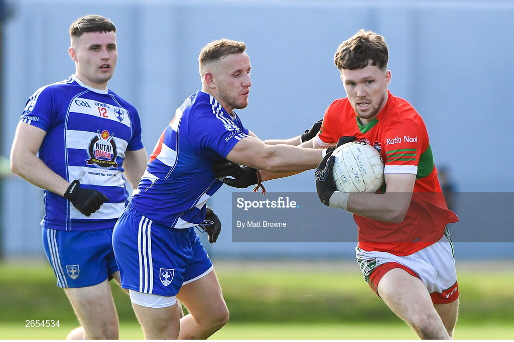 22 October 2023; Sam O'Dowd of Rathnew in action against Kevin Hanlon of Blessington during the Wicklow County Senior Club Football Championship final between Blessington and Rathnew at Echelon Park in Aughrim, Wicklow. Photo by Matt Browne/Sportsfile