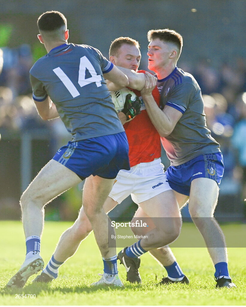 22 October 2023; Donal McKenny of Ardee St Mary's is tackled by Val Leddy of Naomh Martin during the Louth County Senior Club Football Championship final between Ardee St Mary's and Naomh Mairtin at Pairc Naomh Bríd in Dowdallshill, Louth. Photo by Stephen Marken/Sportsfile