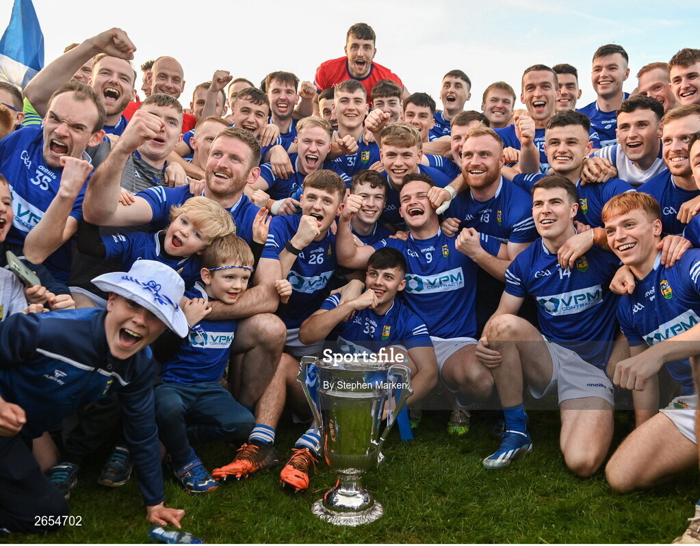 22 October 2023; Ardee St Mary's players and supporters with the Joe Ward Cup after the Louth County Senior Club Football Championship final between Ardee St Mary's and Naomh Mairtin at Pairc Naomh Bríd in Dowdallshill, Louth. Photo by Stephen Marken/Sportsfile