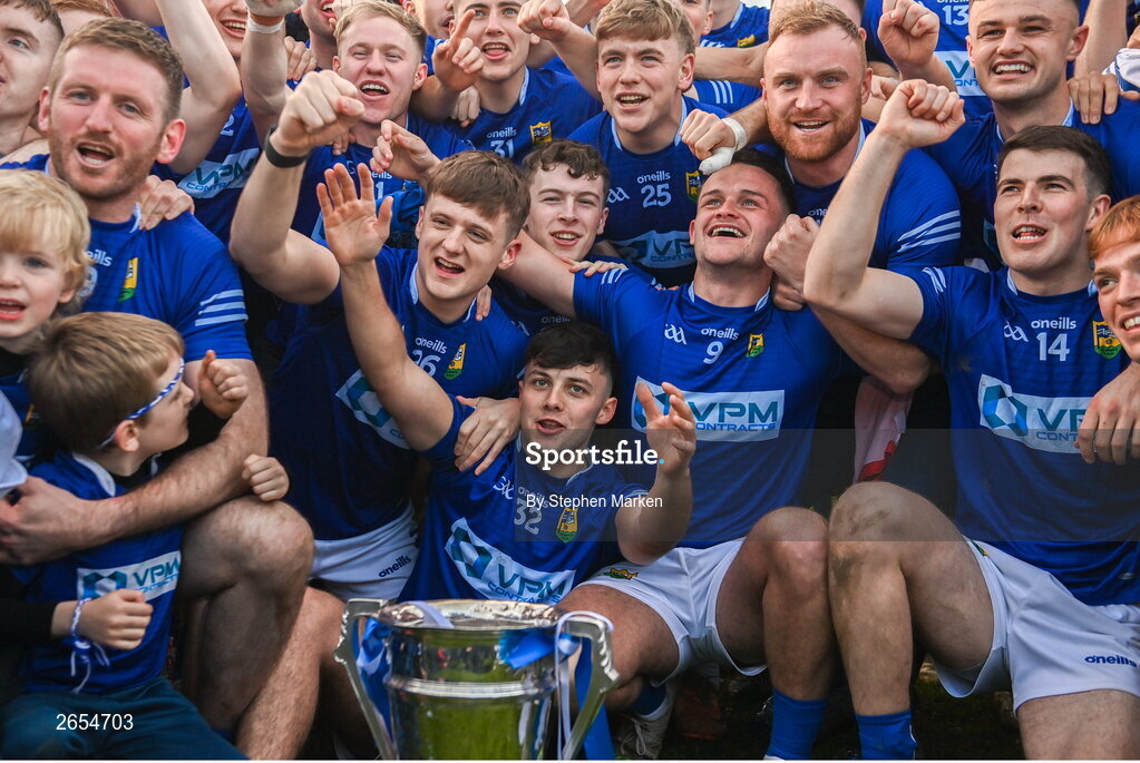 22 October 2023; Ardee St Mary's players and supporters with the Joe Ward Cup after the Louth County Senior Club Football Championship final between Ardee St Mary's and Naomh Mairtin at Pairc Naomh Bríd in Dowdallshill, Louth. Photo by Stephen Marken/Sportsfile