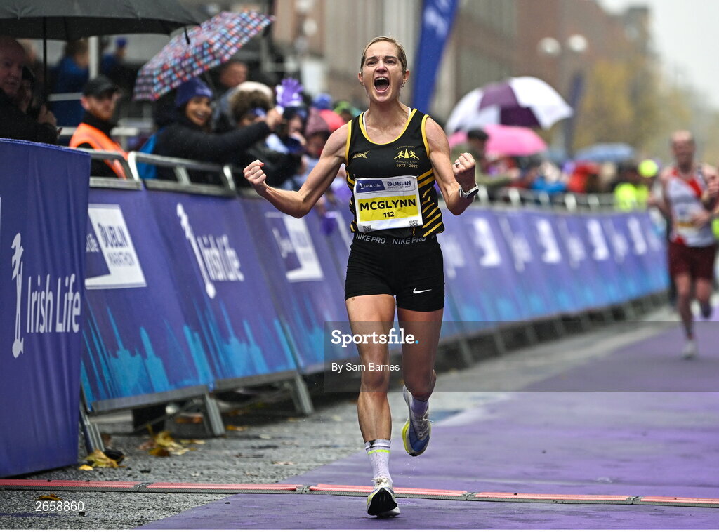 29 October 2023; Irish Women's National Champion Ann-Marie McGlynn celebrates as she crosses the finish line during the 2023 Irish Life Dublin Marathon. Thousands of runners took to the Fitzwilliam Square start line, to participate in the 42nd running of the Dublin Marathon. Photo by Sam Barnes/Sportsfile