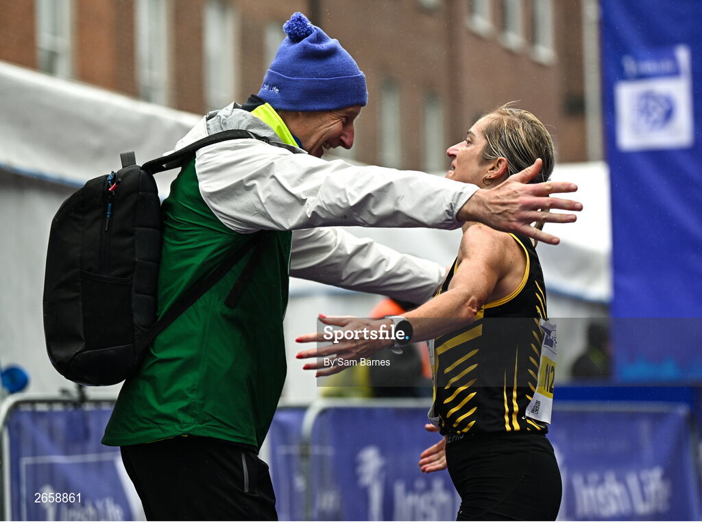 29 October 2023; Irish Women's National Champion Ann-Marie McGlynn celebrates with Race Director Jim Aughney after the 2023 Irish Life Dublin Marathon. Thousands of runners took to the Fitzwilliam Square start line, to participate in the 42nd running of the Dublin Marathon. Photo by Sam Barnes/Sportsfile