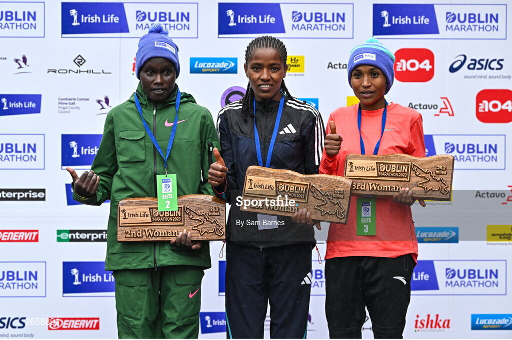 29 October 2023; The Women's event podium, from left, second place Joan Kipyatich, first place Amente Sorome Negash, and third place Genet Abdurkadir, after the 2023 Irish Life Dublin Marathon. Thousands of runners took to the Fitzwilliam Square start line, to participate in the 42nd running of the Dublin Marathon. Photo by Sam Barnes/Sportsfile