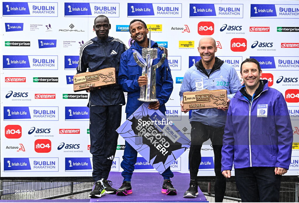 29 October 2023; The Men's event podium, from left, second place Geofrey Kusuro, first place Kemal Husen, and third place Stephen Scullion with Irish Life CEO Declan Bolger after the 2023 Irish Life Dublin Marathon. Thousands of runners took to the Fitzwilliam Square start line, to participate in the 42nd running of the Dublin Marathon. Photo by Sam Barnes/Sportsfile