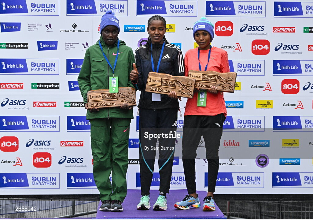 29 October 2023; The Women's event podium, from left, second place Joan Kipyatich, first place Amente Sorome Negash, and third place Genet Abdurkadir, after the 2023 Irish Life Dublin Marathon. Thousands of runners took to the Fitzwilliam Square start line, to participate in the 42nd running of the Dublin Marathon. Photo by Sam Barnes/Sportsfile