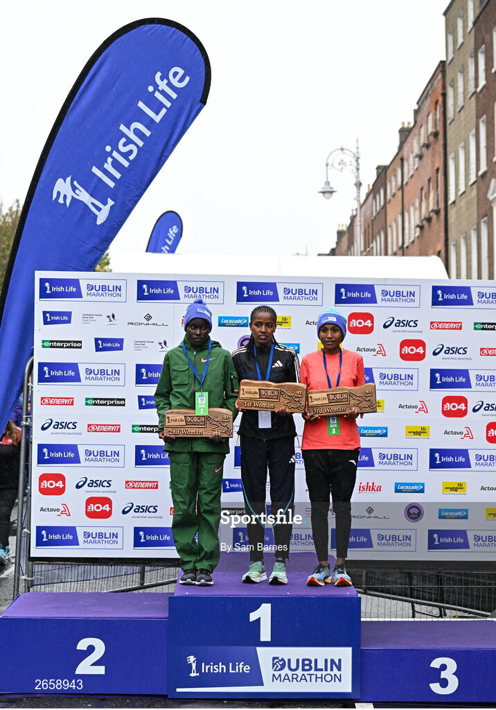 29 October 2023; The Women's event podium, from left, second place Joan Kipyatich, first place Amente Sorome Negash, and third place Genet Abdurkadir, after the 2023 Irish Life Dublin Marathon. Thousands of runners took to the Fitzwilliam Square start line, to participate in the 42nd running of the Dublin Marathon. Photo by Sam Barnes/Sportsfile