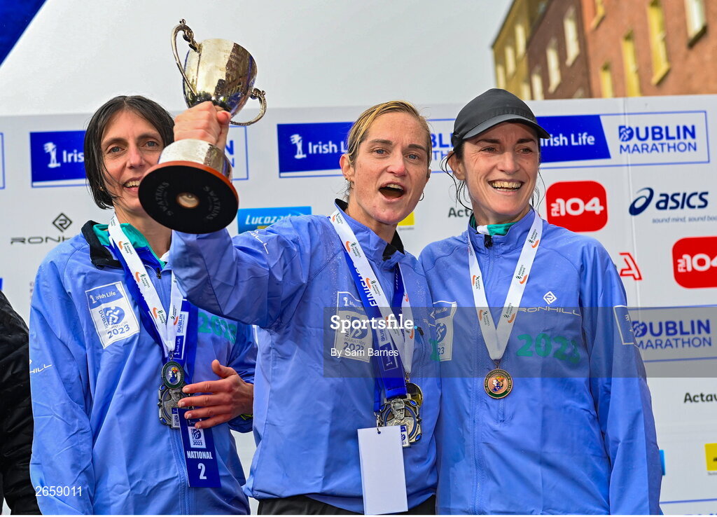 29 October 2023; Women's National Championship podium, from left, second place Gladys Ganiel, first place Ann-Marie Mc Glynn, and third place Sorcha Loughnane from Dublin, after the 2023 Irish Life Dublin Marathon. Thousands of runners took to the Fitzwilliam Square start line, to participate in the 42nd running of the Dublin Marathon. Photo by Sam Barnes/Sportsfile