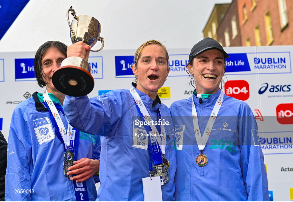 29 October 2023; Women's National Championship podium, from left, second place Gladys Ganiel, first place Ann-Marie Mc Glynn, and third place Sorcha Loughnane from Dublin, after the 2023 Irish Life Dublin Marathon. Thousands of runners took to the Fitzwilliam Square start line, to participate in the 42nd running of the Dublin Marathon. Photo by Sam Barnes/Sportsfile