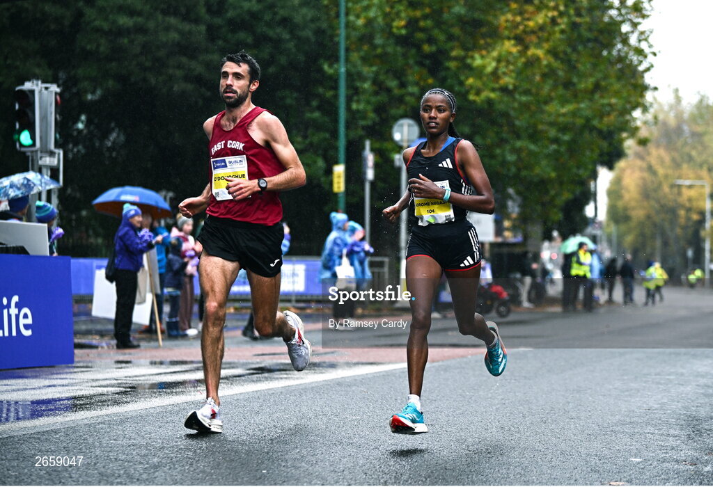 29 October 2023; Amente Sorome Negash, right, during the 2023 Irish Life Dublin Marathon. Thousands of runners took to the Fitzwilliam Square start line, to participate in the 42nd running of the Dublin Marathon. Photo by Ramsey Cardy/Sportsfile