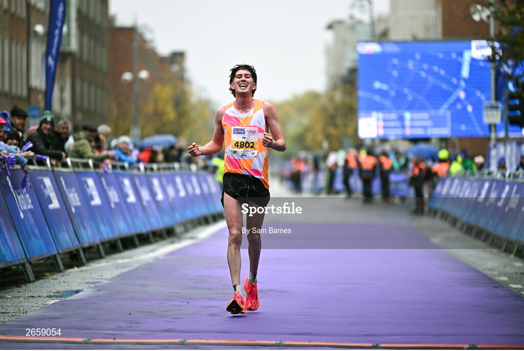 29 October 2023; Karl Fitzmaurice from Clare crosses the finish line during the 2023 Irish Life Dublin Marathon. Thousands of runners took to the Fitzwilliam Square start line, to participate in the 42nd running of the Dublin Marathon. Photo by Sam Barnes/Sportsfile