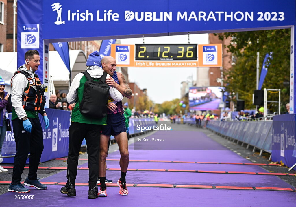 29 October 2023; Stephen Scullion celebrates with Race Director Jim Aughney after the 2023 Irish Life Dublin Marathon. Thousands of runners took to the Fitzwilliam Square start line, to participate in the 42nd running of the Dublin Marathon. Photo by Sam Barnes/Sportsfile