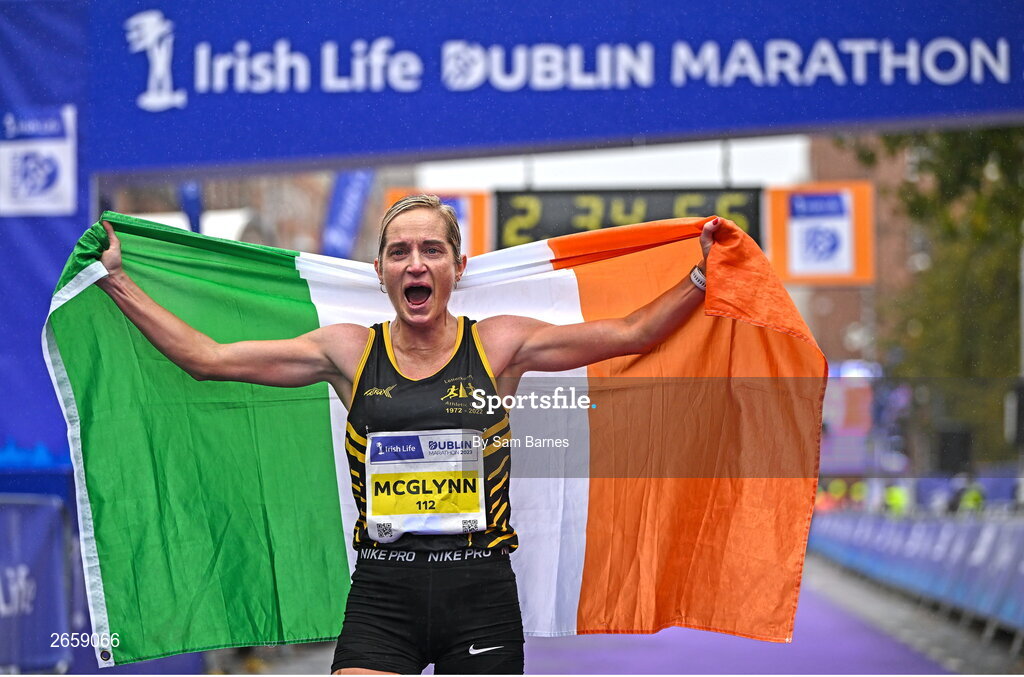 29 October 2023; Women's National Champion Ann-Marie McGlynn celebrates after the 2023 Irish Life Dublin Marathon. Thousands of runners took to the Fitzwilliam Square start line, to participate in the 42nd running of the Dublin Marathon. Photo by Sam Barnes/Sportsfile