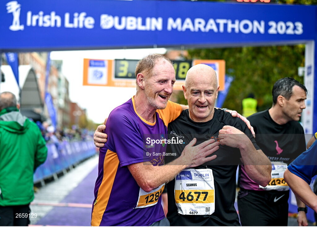 29 October 2023; Michael Quigley from Wexford and Seamus Doherty from Donegal, after the 2023 Irish Life Dublin Marathon. Thousands of runners took to the Fitzwilliam Square start line, to participate in the 42nd running of the Dublin Marathon. Photo by Sam Barnes/Sportsfile