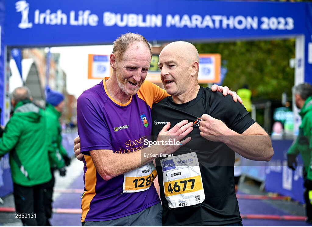 29 October 2023; Michael Quigley from Wexford and Seamus Doherty from Donegal, after the 2023 Irish Life Dublin Marathon. Thousands of runners took to the Fitzwilliam Square start line, to participate in the 42nd running of the Dublin Marathon. Photo by Sam Barnes/Sportsfile