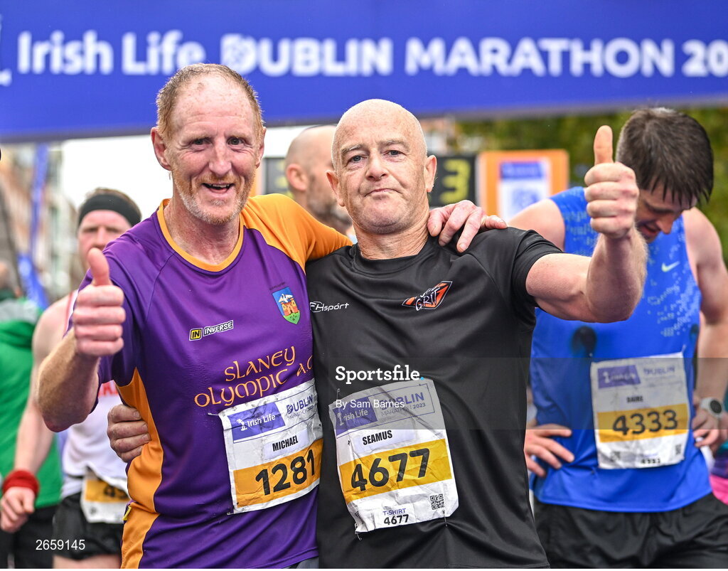 29 October 2023; Michael Quigley from Wexford and Seamus Doherty from Donegal, after the 2023 Irish Life Dublin Marathon. Thousands of runners took to the Fitzwilliam Square start line, to participate in the 42nd running of the Dublin Marathon. Photo by Sam Barnes/Sportsfile