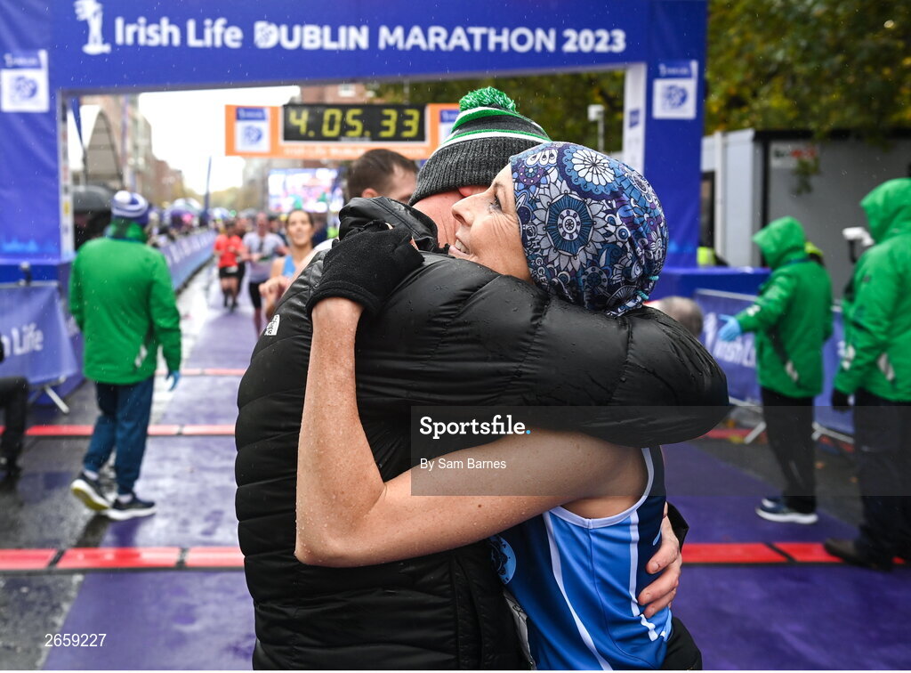 29 October 2023; Rita Casey from Mayo with her husband John Casey after the 2023 Irish Life Dublin Marathon. Thousands of runners took to the Fitzwilliam Square start line, to participate in the 42nd running of the Dublin Marathon. Photo by Sam Barnes/Sportsfile