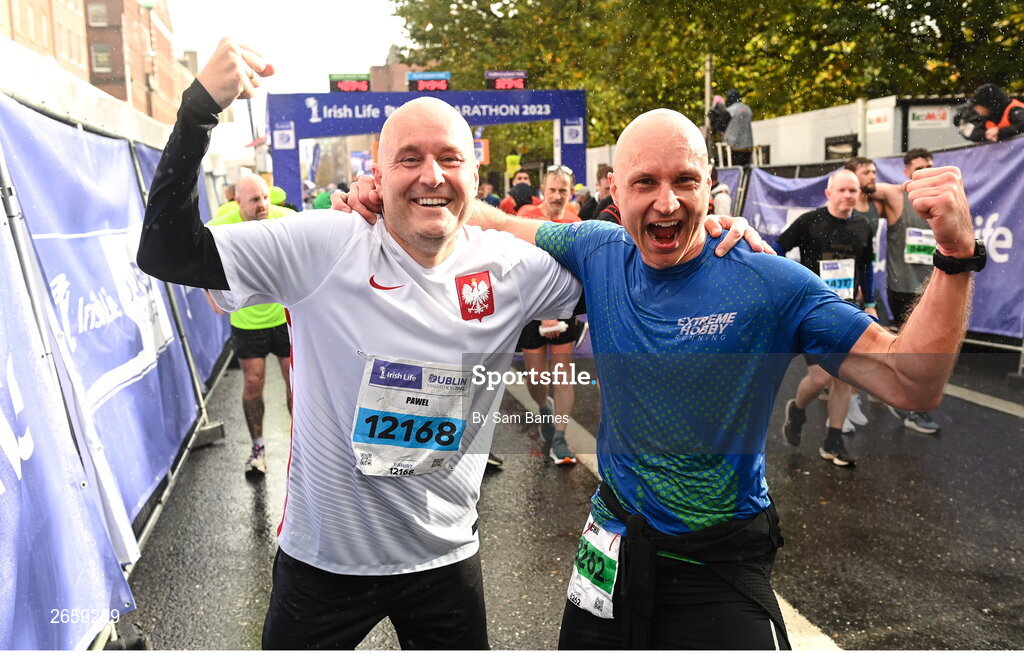29 October 2023; Pawel Romanczyk and Michal Romanczyk after the 2023 Irish Life Dublin Marathon. Thousands of runners took to the Fitzwilliam Square start line, to participate in the 42nd running of the Dublin Marathon. Photo by Sam Barnes/Sportsfile