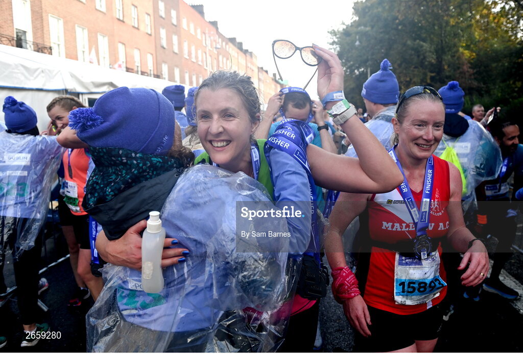 29 October 2023; Participants receive their medals after the 2023 Irish Life Dublin Marathon. Thousands of runners took to the Fitzwilliam Square start line, to participate in the 42nd running of the Dublin Marathon. Photo by Sam Barnes/Sportsfile