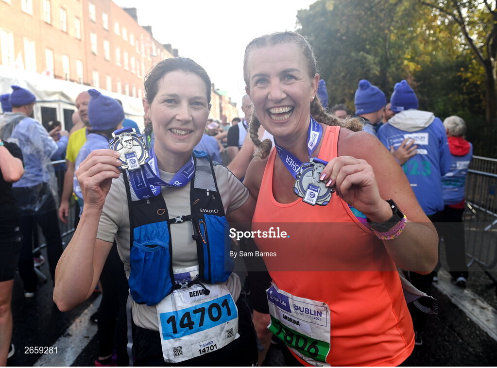 29 October 2023; Derval Fitzgerald and Andrina Ryan from Kildare with their medals after the 2023 Irish Life Dublin Marathon. Thousands of runners took to the Fitzwilliam Square start line, to participate in the 42nd running of the Dublin Marathon. Photo by Sam Barnes/Sportsfile