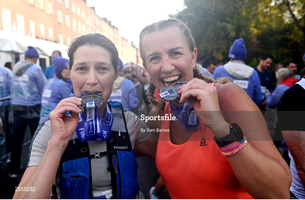 29 October 2023; Derval Fitzgerald and Andrina Ryan from Kildare with their medals after the 2023 Irish Life Dublin Marathon. Thousands of runners took to the Fitzwilliam Square start line, to participate in the 42nd running of the Dublin Marathon. Photo by Sam Barnes/Sportsfile