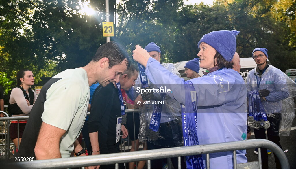 29 October 2023; Participants receive their medals after the 2023 Irish Life Dublin Marathon. Thousands of runners took to the Fitzwilliam Square start line, to participate in the 42nd running of the Dublin Marathon. Photo by Sam Barnes/Sportsfile