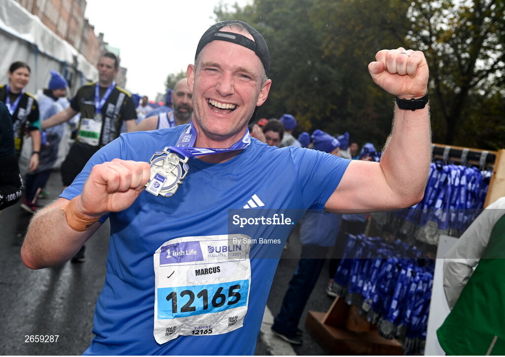 29 October 2023; Marcus Ó Buachalla from Dublin with his medal after the 2023 Irish Life Dublin Marathon. Thousands of runners took to the Fitzwilliam Square start line, to participate in the 42nd running of the Dublin Marathon. Photo by Sam Barnes/Sportsfile