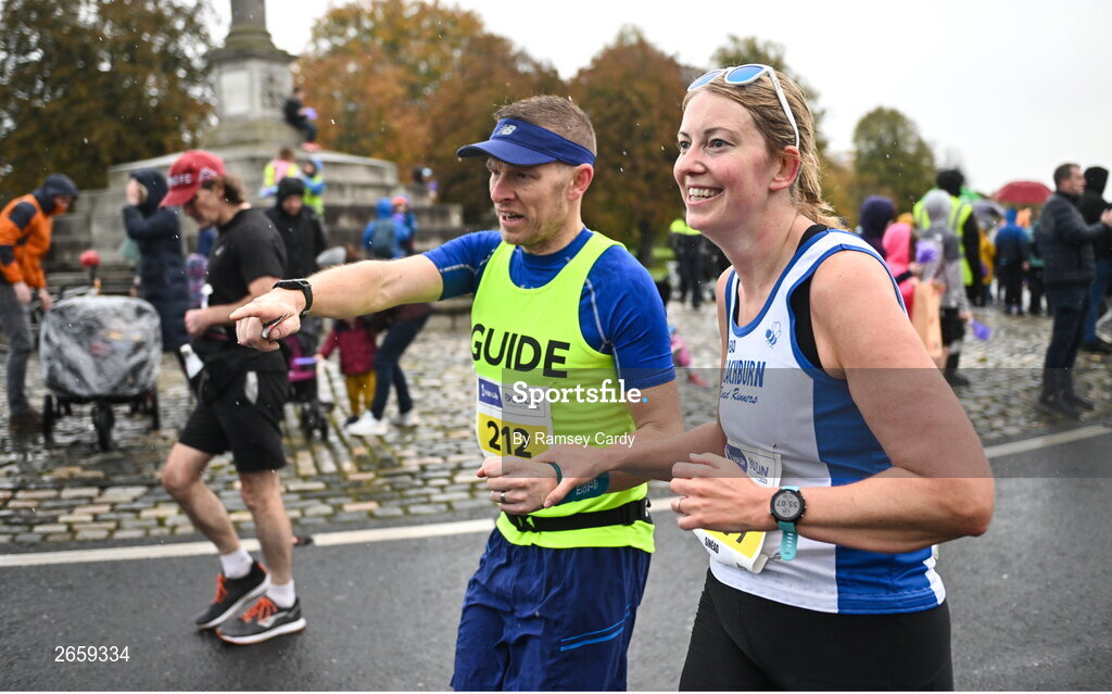 29 October 2023; Sinéad Simpson, with her guide Matt Simpson during the 2023 Irish Life Dublin Marathon. Thousands of runners took to the Fitzwilliam Square start line, to participate in the 42nd running of the Dublin Marathon. Photo by Ramsey Cardy/Sportsfile