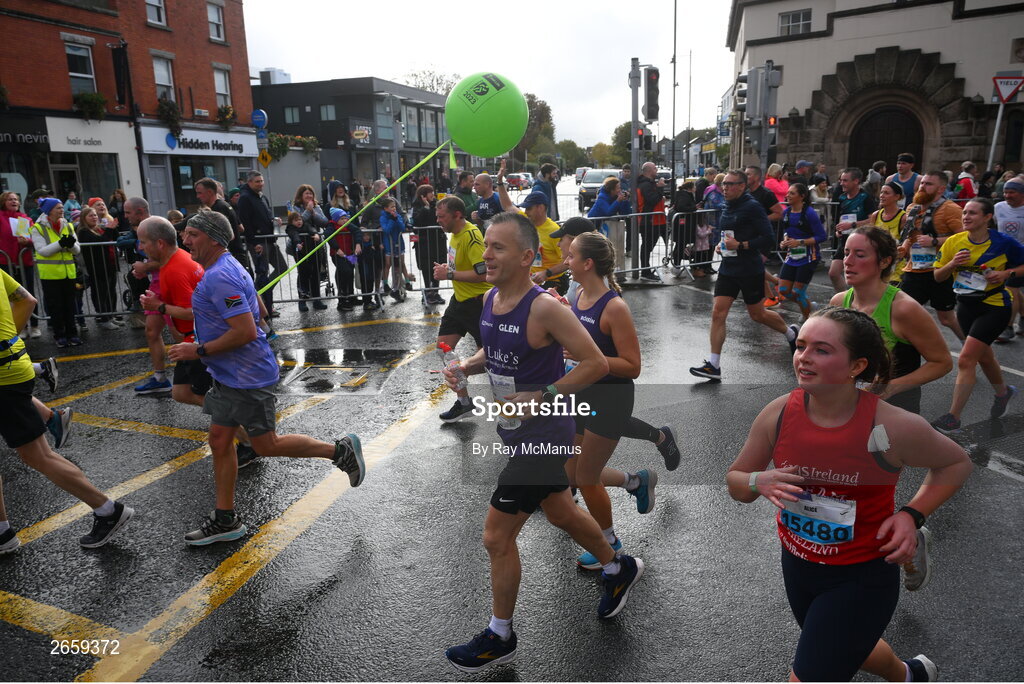29 October 2023; Participants following a 4:10 pace pass through Terenure during the 2023 Irish Life Dublin Marathon. Thousands of runners took to the Fitzwilliam Square start line, to participate in the 42nd running of the Dublin Marathon. Photo by Ray McManus/Sportsfile