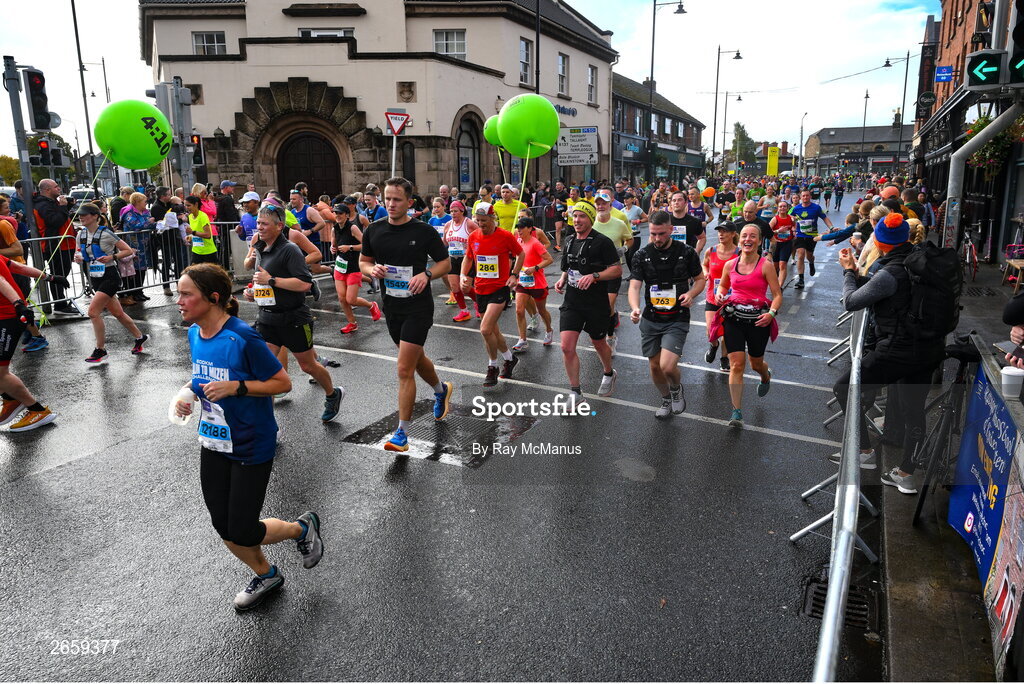 29 October 2023; Participants following a 4:10 pace pass through Terenure during the 2023 Irish Life Dublin Marathon. Thousands of runners took to the Fitzwilliam Square start line, to participate in the 42nd running of the Dublin Marathon. Photo by Ray McManus/Sportsfile