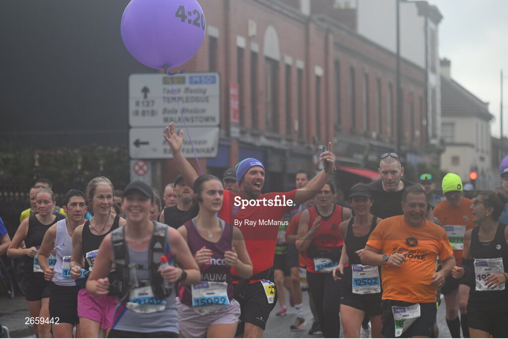 29 October 2023; Participants following a 4:20 pace pass through Terenure during the 2023 Irish Life Dublin Marathon. Thousands of runners took to the Fitzwilliam Square start line, to participate in the 42nd running of the Dublin Marathon. Photo by Ray McManus/Sportsfile