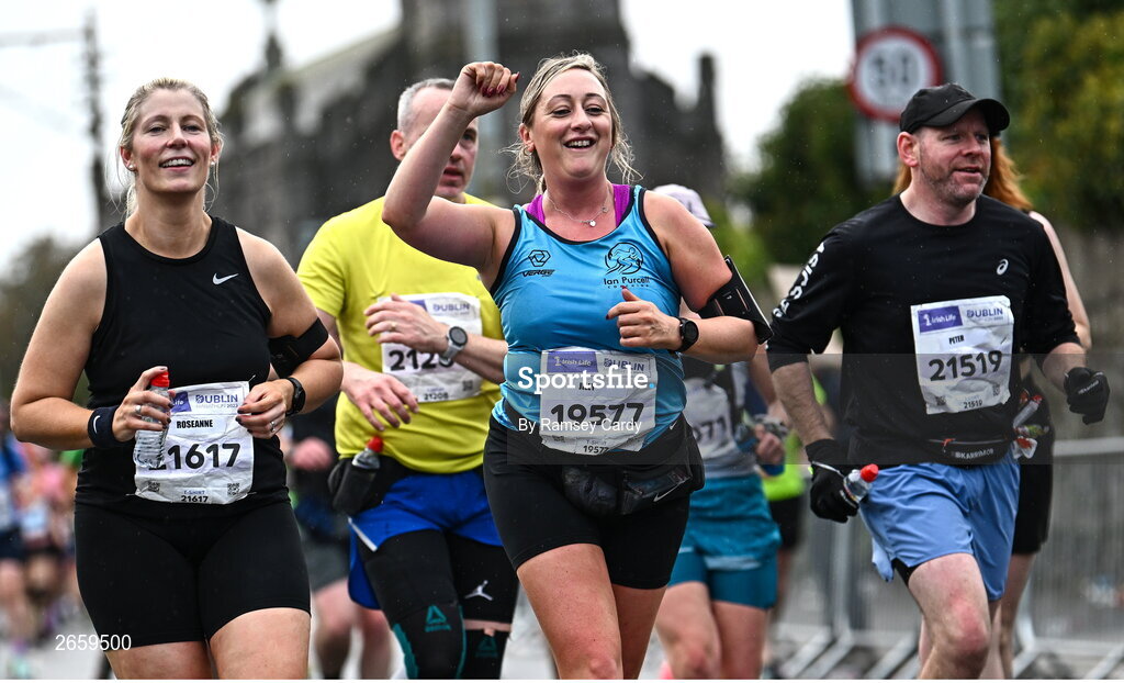 29 October 2023; Keith Kirwan from Dublin, left, and Jilly Powell from Tipperary, during the 2023 Irish Life Dublin Marathon. Thousands of runners took to the Fitzwilliam Square start line, to participate in the 42nd running of the Dublin Marathon. Photo by Ramsey Cardy/Sportsfile