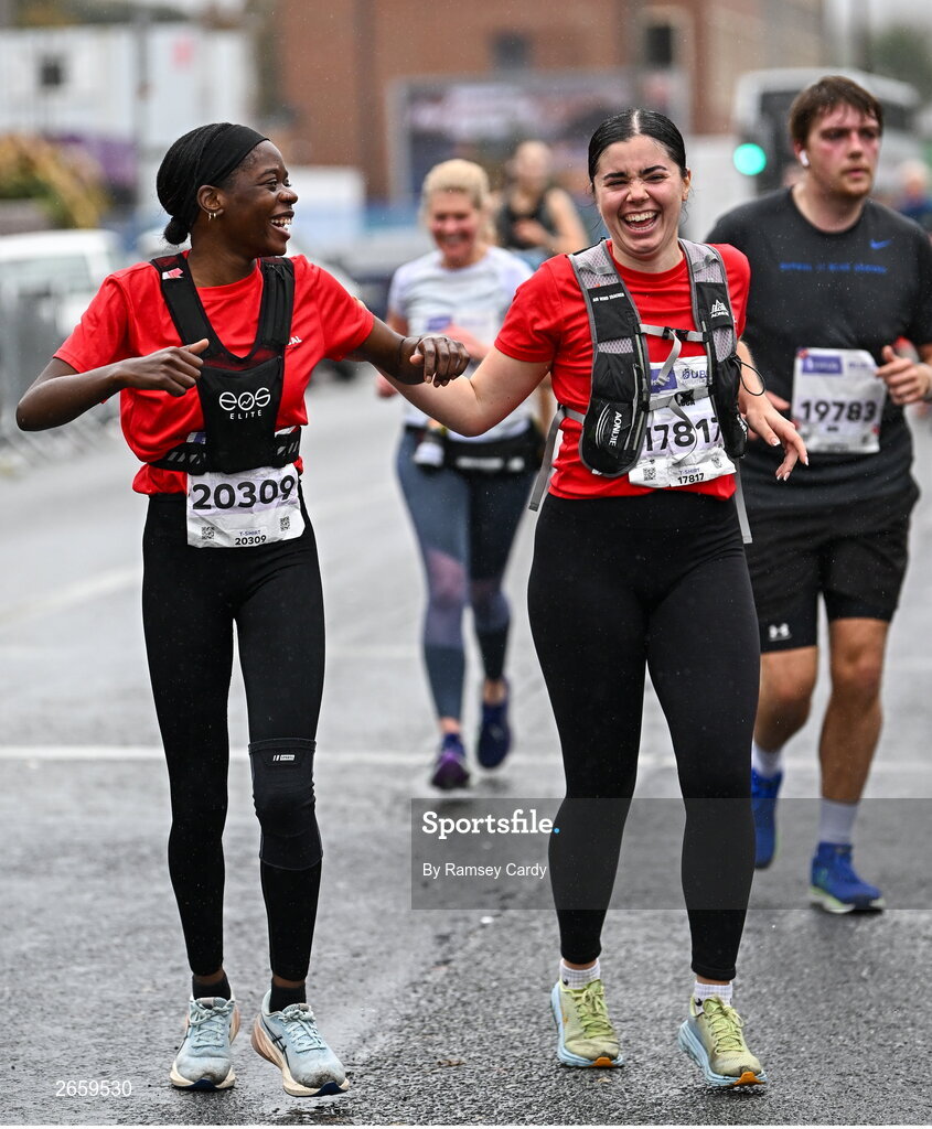29 October 2023; Lola Folorunso, left, and Rebecca Kidney from Dublin 3, during the 2023 Irish Life Dublin Marathon. Thousands of runners took to the Fitzwilliam Square start line, to participate in the 42nd running of the Dublin Marathon. Photo by Ramsey Cardy/Sportsfile