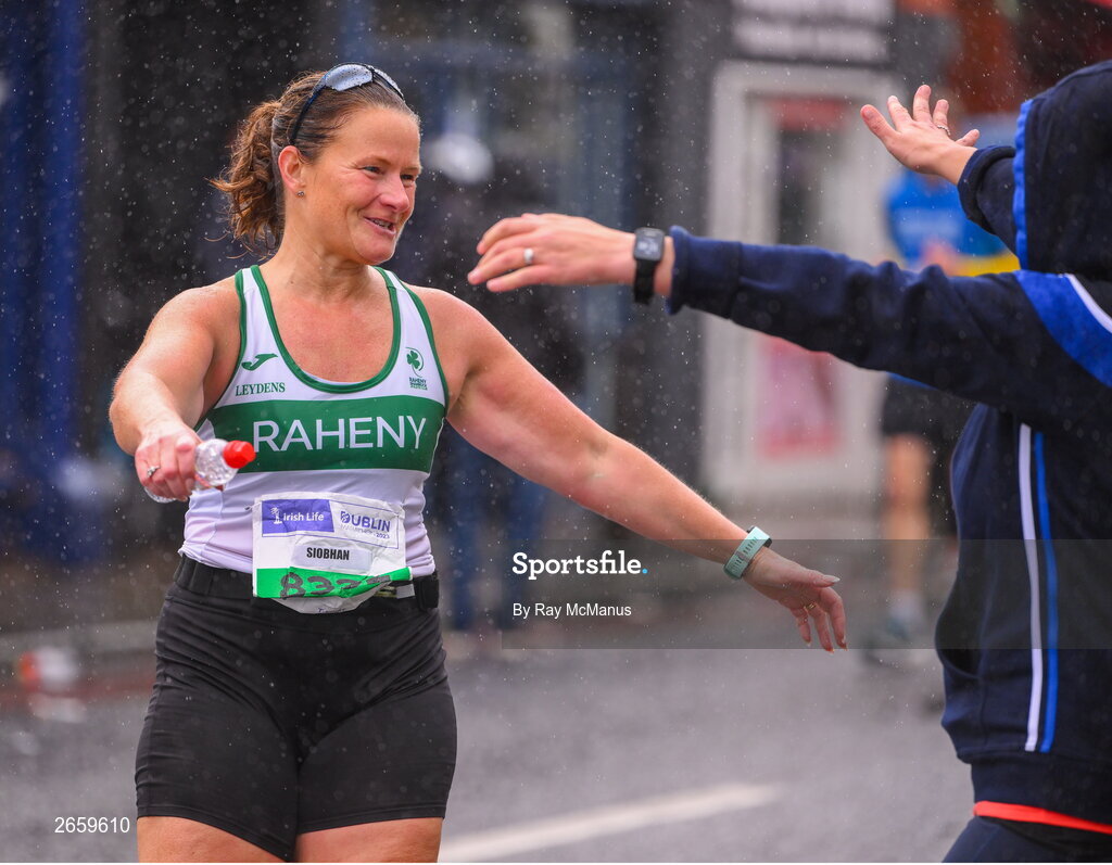 29 October 2023; Sarah Dillon goes to hug Siobhan Foley, left, during the 2023 Irish Life Dublin Marathon. Thousands of runners took to the Fitzwilliam Square start line, to participate in the 42nd running of the Dublin Marathon. Photo by Ray McManus/Sportsfile