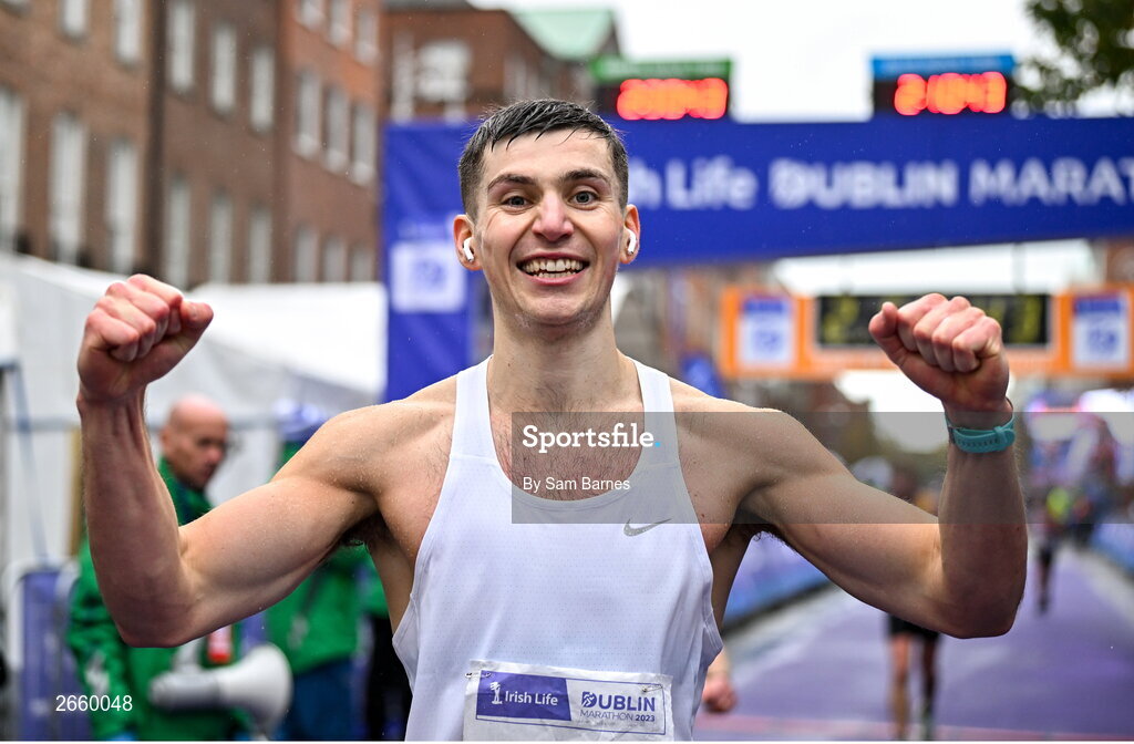 29 October 2023; Michael Boland from Dublin 15,  celebrates finishing the 2023 Irish Life Dublin Marathon. Thousands of runners took to the Fitzwilliam Square start line, to participate in the 42nd running of the Dublin Marathon. Photo by Sam Barnes/Sportsfile