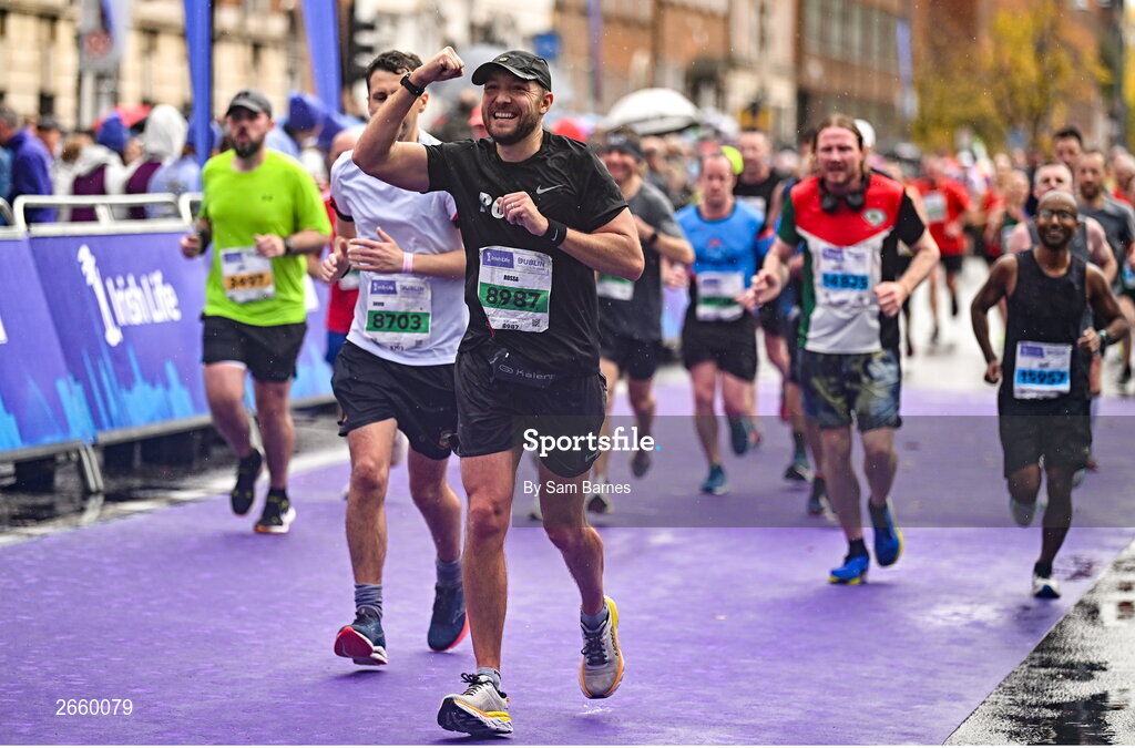 29 October 2023; Rossa Malone from Dublin 3, celebrates finishing the 2023 Irish Life Dublin Marathon. Thousands of runners took to the Fitzwilliam Square start line, to participate in the 42nd running of the Dublin Marathon. Photo by Sam Barnes/Sportsfile