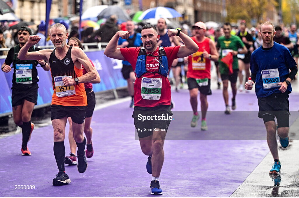29 October 2023; Paul De Freine from Dublin, left, and Andrew Clarges from Kildare, celebrate finishing the 2023 Irish Life Dublin Marathon. Thousands of runners took to the Fitzwilliam Square start line, to participate in the 42nd running of the Dublin Marathon. Photo by Sam Barnes/Sportsfile