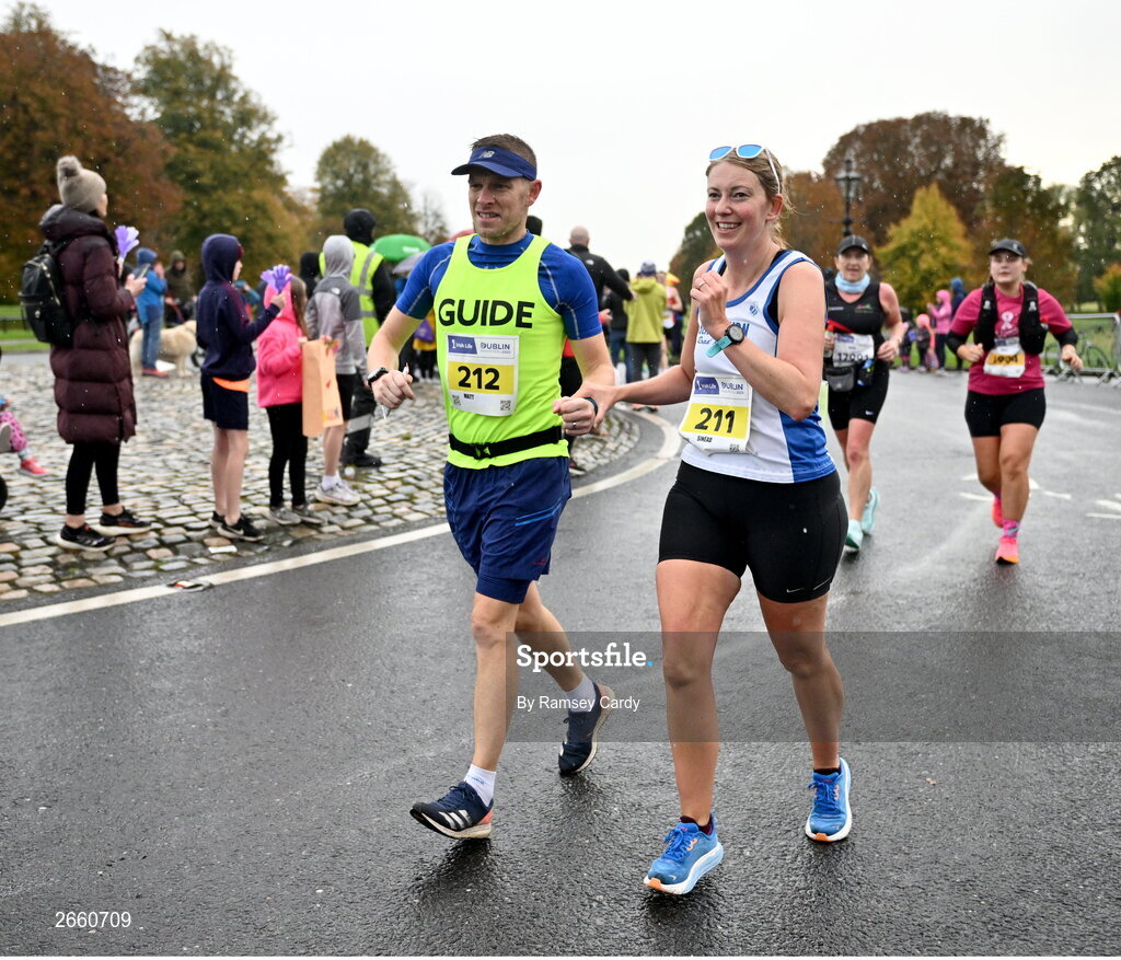 29 October 2023; Sinéad Simpson, with her guide Matt Simpson during the 2023 Irish Life Dublin Marathon. Thousands of runners took to the Fitzwilliam Square start line, to participate in the 42nd running of the Dublin Marathon. Photo by Ramsey Cardy/Sportsfile