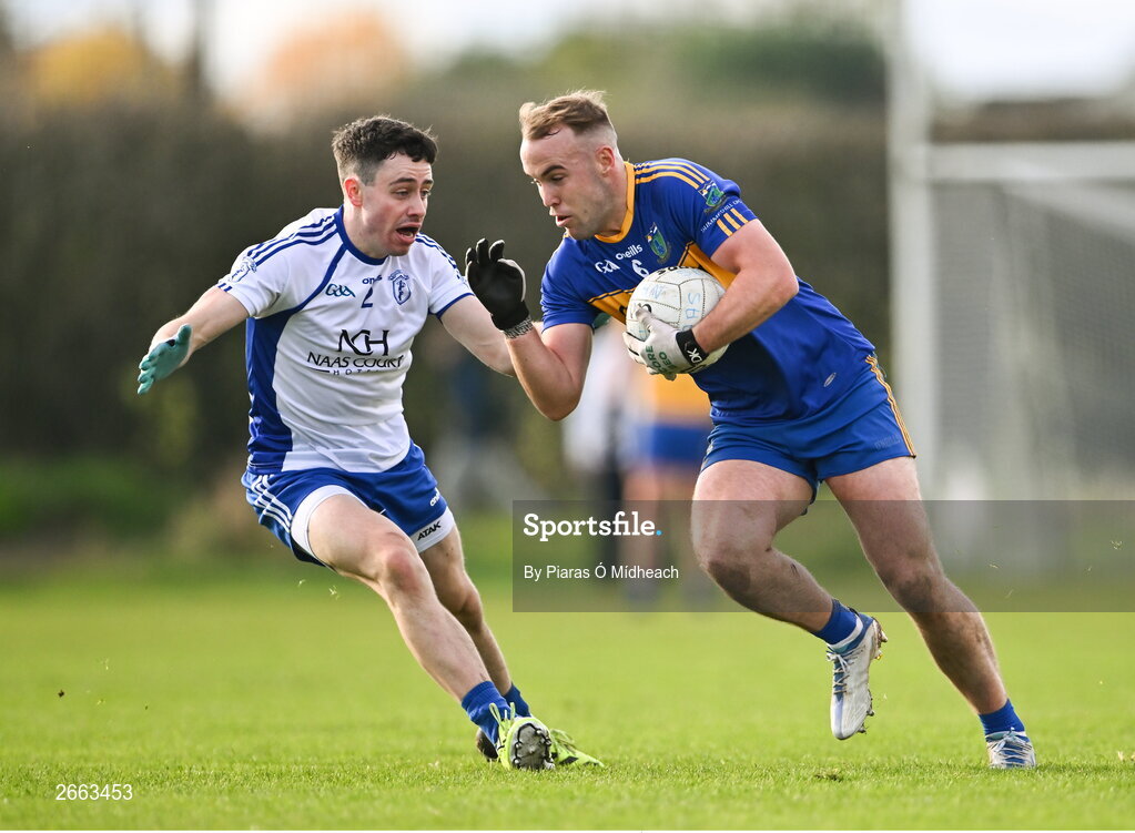 5 November 2023; Ross Ryan of Summerhill in action against Cathal Daly of Naas during the AIB Leinster GAA Football Senior Club Championship quarter-final match between Naas and Summerhill at Manguard Park in Kildare. Photo by Piaras Ó Mídheach/Sportsfile