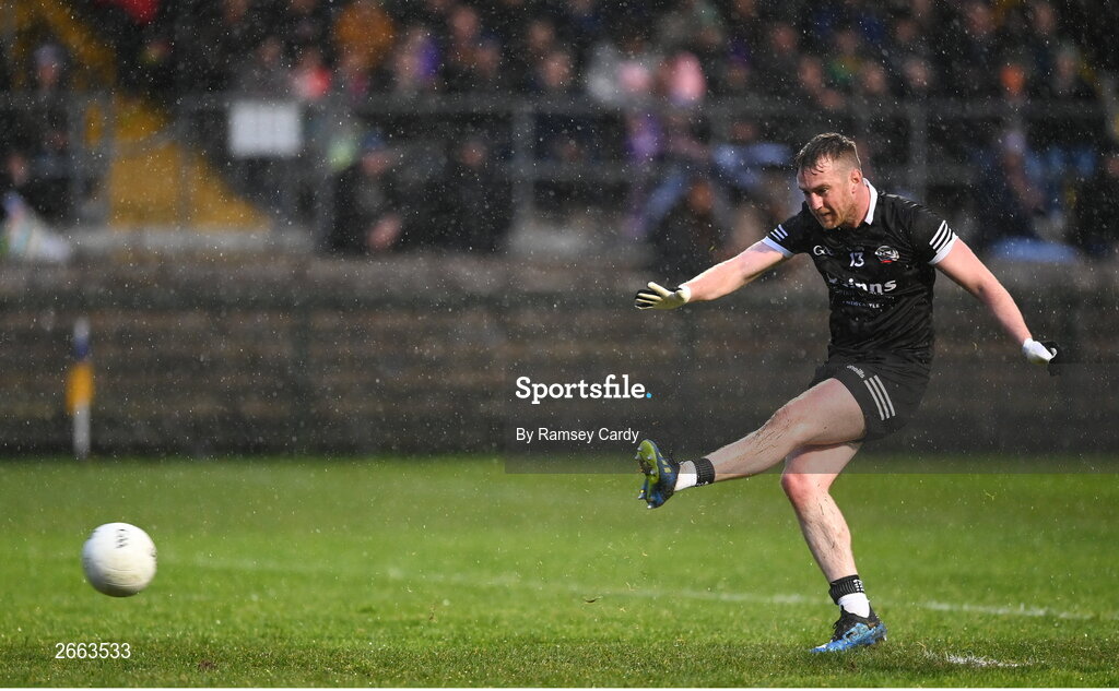 5 November 2023; Paul Devlin of Kilcoo scores his side's first goal from a penalty during the AIB Ulster GAA Football Senior Club Championship round 1 match between Derrygonnelly Harps of Fermanagh and Kilcoo of Down at Brewster Park in Enniskillen, Fermanagh. Photo by Ramsey Cardy/Sportsfile