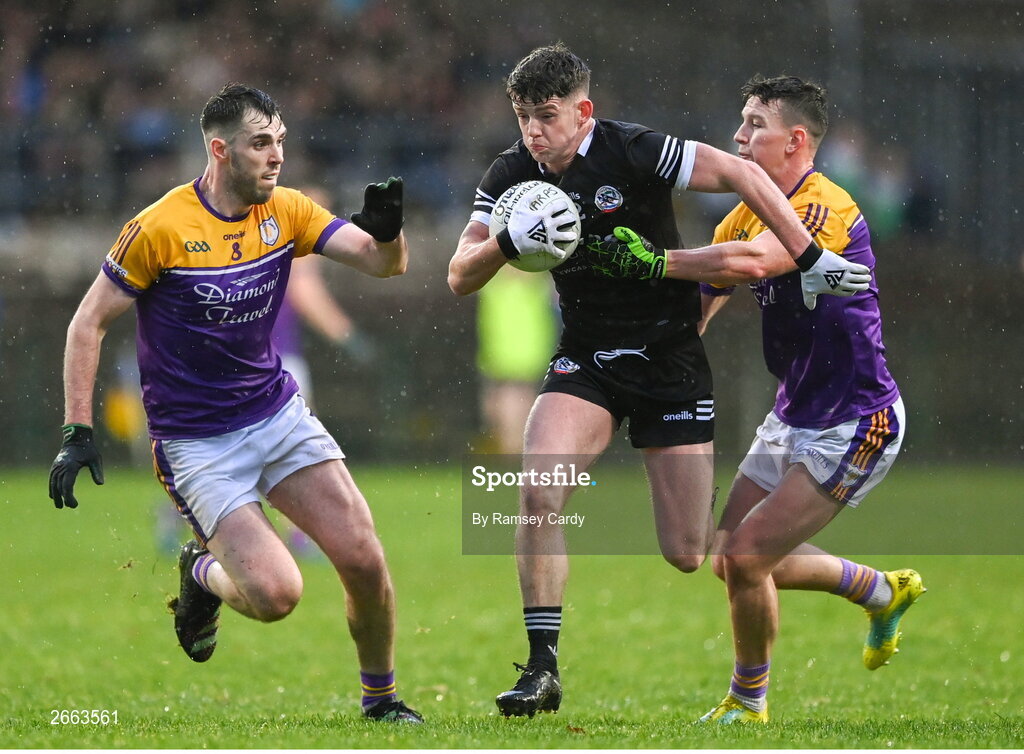 5 November 2023; Anthony Morgan of Kilcoo in action against Ryan Jones, left, and Shane McGullion of Derrygonnelly Harps during the AIB Ulster GAA Football Senior Club Championship round 1 match between Derrygonnelly Harps of Fermanagh and Kilcoo of Down at Brewster Park in Enniskillen, Fermanagh. Photo by Ramsey Cardy/Sportsfile