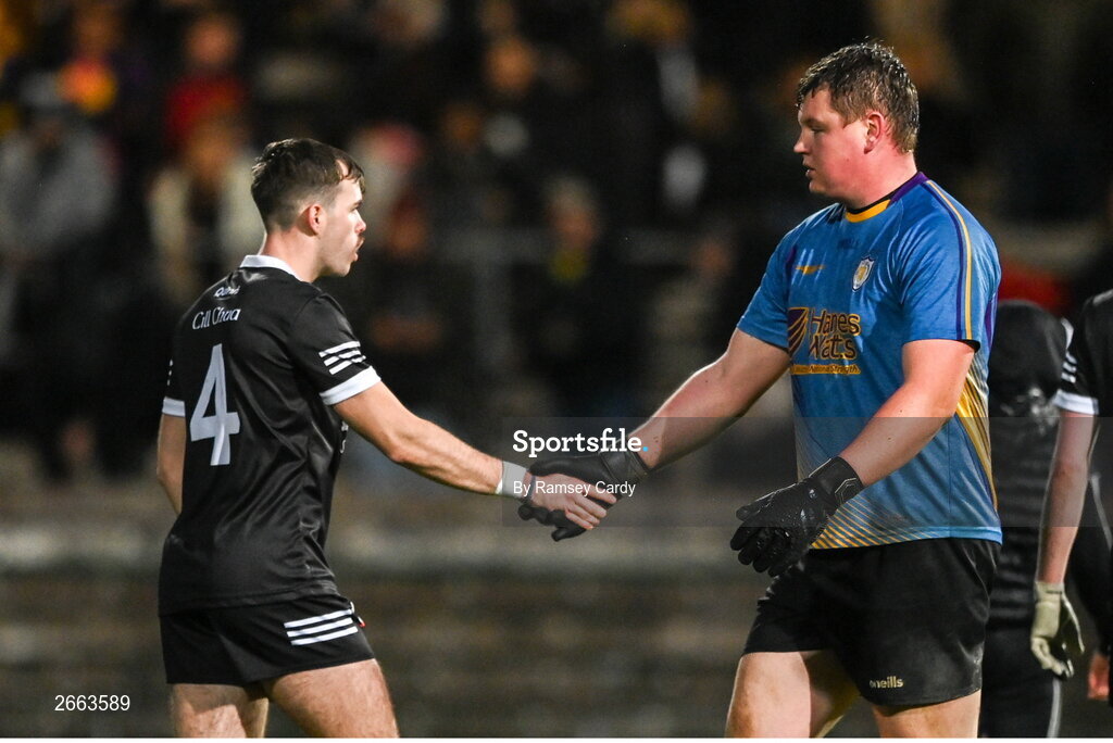 5 November 2023; Callum Rogers of Kilcoo and Derrygonnelly Harps goalkeeper Jack Kelly shake hands after the AIB Ulster GAA Football Senior Club Championship round 1 match between Derrygonnelly Harps of Fermanagh and Kilcoo of Down at Brewster Park in Enniskillen, Fermanagh. Photo by Ramsey Cardy/Sportsfile