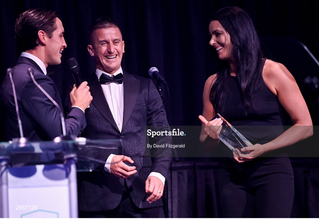 11 November 2023; Olympians Rob and Marian Heffernan are interviewd by MC Greg O'Shea after being presented with the Flogas Community Ambassador of the year award at the Team Ireland Olympic Ball at the Mansion House in Dublin. The event was a joint celebration of the brilliant performances of Team Ireland athletes at the European Games this summer, as well as the announcement of the winners of the Olympic Federation of Ireland Annual Awards. The event was attended by the Minister for Tourism, Culture, Arts, Gaeltacht, Sport and Media, Catherine Martin TD, Minister of State for Sport and Physical Education, Thomas Byrne TD, Olympic medallists, European Games athletes, Team Ireland Sponsors and Partners, Sport Ireland and the wider Olympic family. Photo by David Fitzgerald/Sportsfile