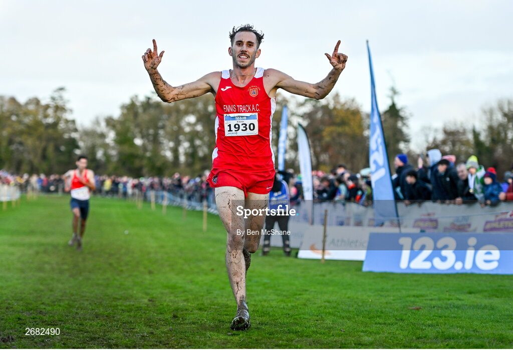 19 November 2023; Kevin Mulcaire of Ennis Track AC, Clare, celebrates on his way to finishing second place in the Mens Senior 9000m during the 123.ie National Senior & Even Age Cross Country Championships at Gowran Demesne in Kilkenny. Photo by Ben McShane/Sportsfile