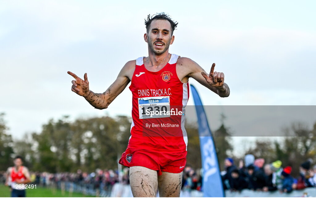 19 November 2023; Kevin Mulcaire of Ennis Track AC, Clare, celebrates on his way to finishing second place in the Mens Senior 9000m during the 123.ie National Senior & Even Age Cross Country Championships at Gowran Demesne in Kilkenny. Photo by Ben McShane/Sportsfile