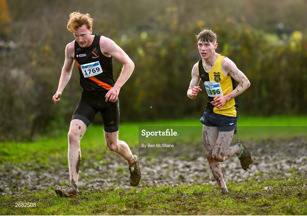 19 November 2023; Cathal O'reilly of Kilkenny City Harriers AC, Kilkenny, right, and Sean O'leary of Clonliffe Harriers AC, Dublin, competing in the Mens U23 9000m during the 123.ie National Senior & Even Age Cross Country Championships at Gowran Demesne in Kilkenny. Photo by Ben McShane/Sportsfile